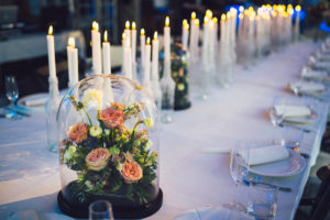 Floral arrangement under a glass dome - cloche roses