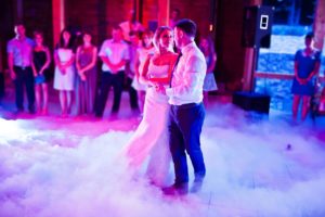 bride and groom dancing with fog on dancefloor