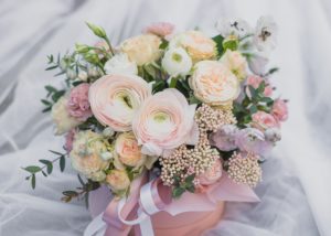 Bridal bouquet with peach and cream ranunuculas and white flowers