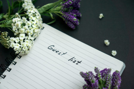 Handwriting,Text,With,Violet,Flowers,,Black,Background
