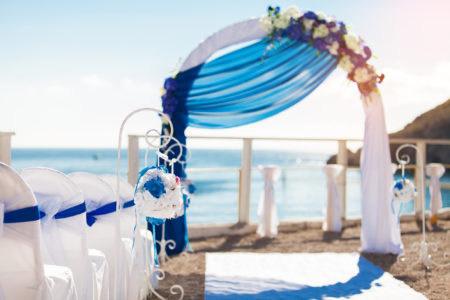 Wedding on the beach. Beautiful wedding arch, decorated with flowers