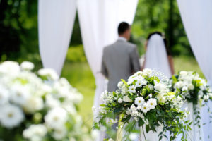 White flowers decorations during outdoor wedding ceremony