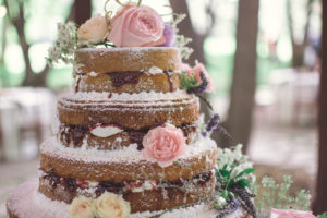 Naked wedding cake with fresh roses