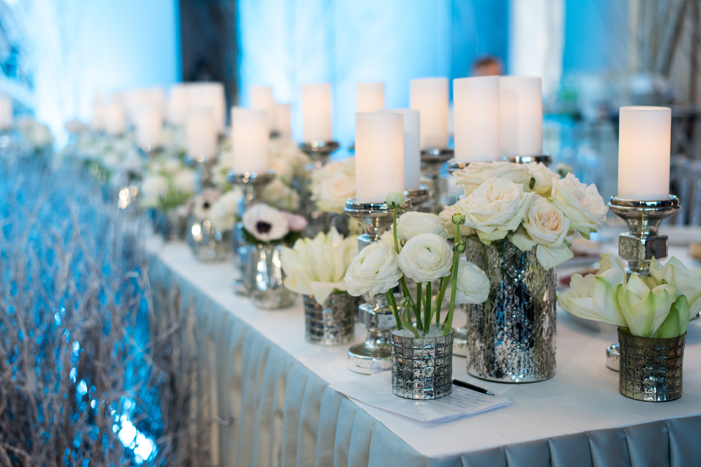 Table with candles, flowers, and blue lighting