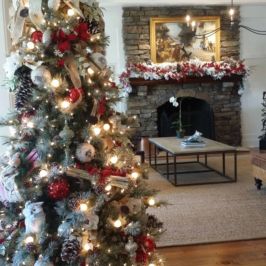 Indoor lit Christmas tree and holiday decor