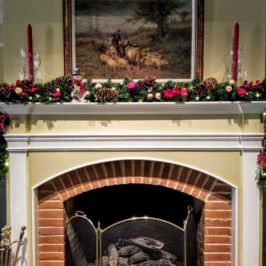 Indoor holiday mantle decor with garland