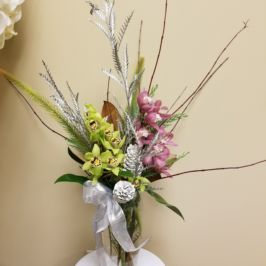 Tall centerpiece featuring orchids