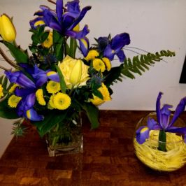 Bright yellow and purple floral centerpieces