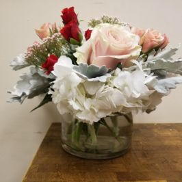 Arrangement with roses, hydrangea and dusty miller