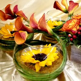 Arrangements with sunflowers and calla lilies