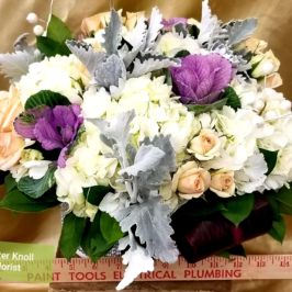 Arrangement of white, purple and peach flowers