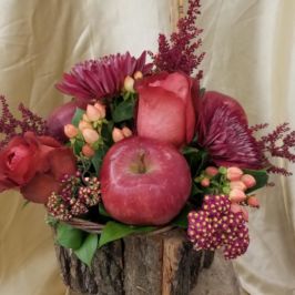 Rustic bouquet of red flowers and apples