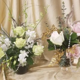 Centerpieces with light green and pink flowers