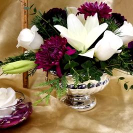 Centerpieces of white and purple flowers