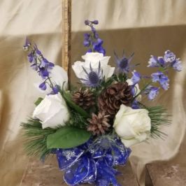 Bouquet of white and blue flowers with blue ribbon