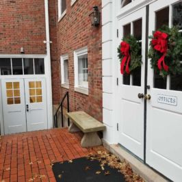 Holiday wreaths displayed outside