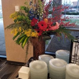 Tall centerpiece of bright flowers