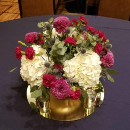 Low centerpiece of white and pink flowers