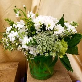 Arrangement of white flowers and greenery