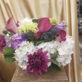 Arrangement of purple and white flowers