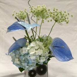 Cube arrangement of blue flowers