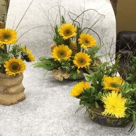 Centerpiece arrangements with sunflowers