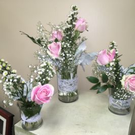Trio of centerpieces with pink roses
